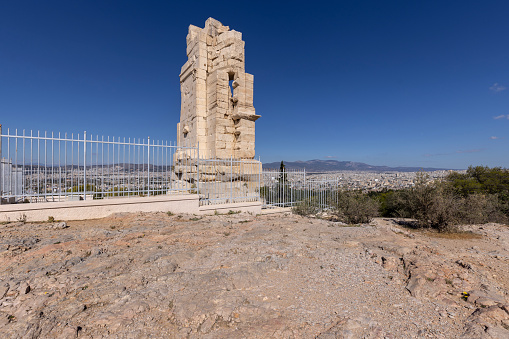 Athens, Greece - October 17, 2022:  Philopappos Monument, ancient Greek mausoleum on Mouseion Hill