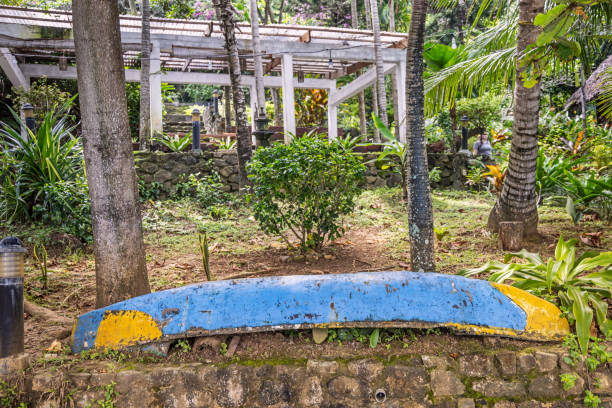 Sabang, Pulau Weh, Indonesia - January 12th 2024: Dugout painted canoe laying on land