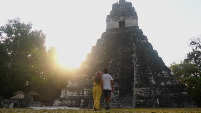 Couple sightseeing the Tikal ruins in Guatemala