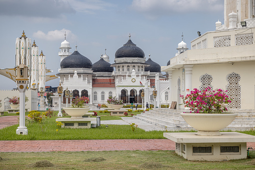 The great mosque, Banda Aceh, Sumatra, Indonesia - January 15th 2024:  Architectural details of the large mosque with domes and minarets