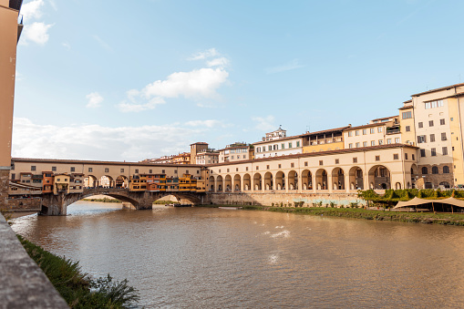 Beautiful amazing bridge with vintage buildings and arches in the ancient city of Florence, Italy