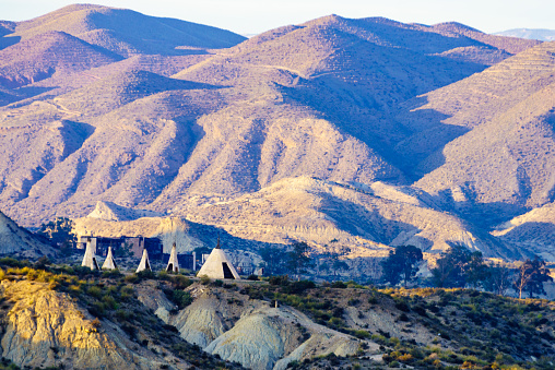 Tabernas desert landscape and Red Indian village with wigwams at Western Leone town, Almeria, Spain. Movie location set for spaghetti western.