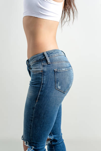 istock Side view of slim women and jeans 2120249157