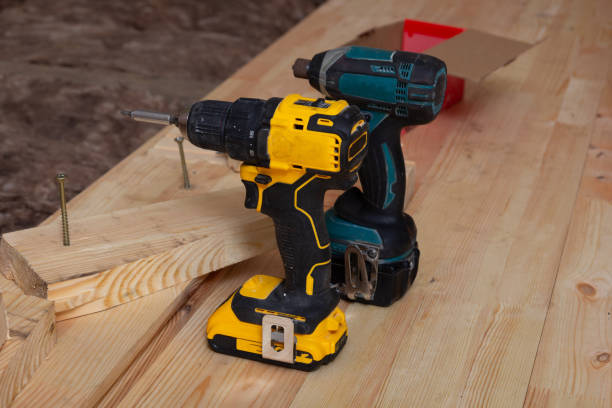 istock Carpenter's tools on a new wooden plank floor. 2120252403