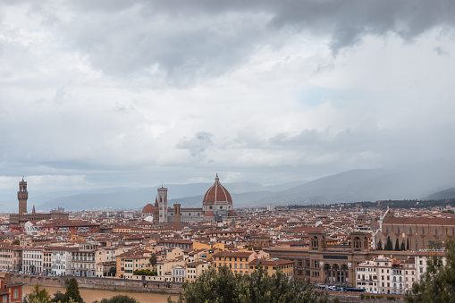 Beautiful vintage city with old houses and cathedral in Florence, Italy on a cloudy rainy day