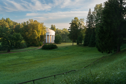 View of the Temple of Friendship on the bank of the Slavyanka River in the Pavlovsky Park on a sunny summer day, Pavlovsk, Saint Petersburg, Russia