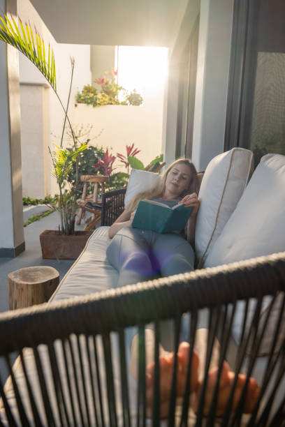 istock Full length image of young woman deeply focused on writing 2120308635