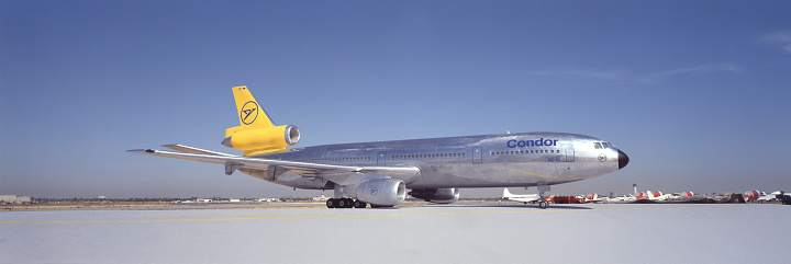 Long Beach, California, USA - about 1979: McDonnell-Douglas DC-10 in Condor Airlines livery on runway at Long Beach airport. Airplane is a model photographed at ground level.