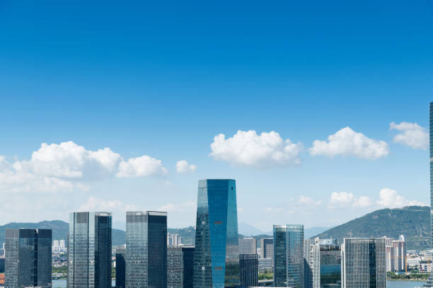 Landscape of city buildings under cloud sky.