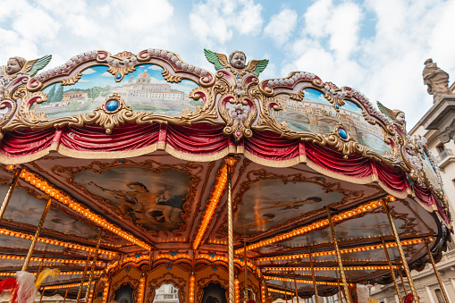 Beautiful vintage carousel with lights and stucco in the Italian city of Florence
