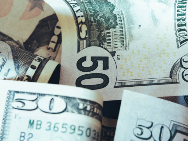 istock Banknotes with a face value of 50 dollars close-up. American paper money. 2120378708