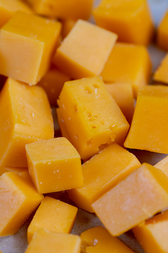 sliced orange cheese made from cow's milk, high-quality long-aged orange cheese made from milk