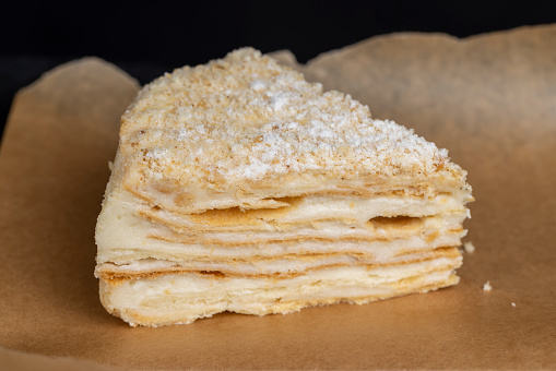 multi-layered cake made of buttercream and thin wheat cakes, delicious milk cake close-up