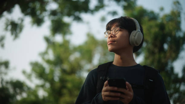 istock Asian man checking navigation maps on smartphone while travel. 2120400807