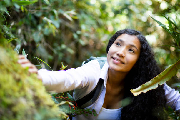 Happy woman walking in the forest