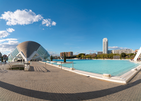 City of Arts and Science in Valencia. View of Hemisferic building, a modern architecture theatre. Famous travel destination. People visiting the building. Architect Santiago Calatrava.
