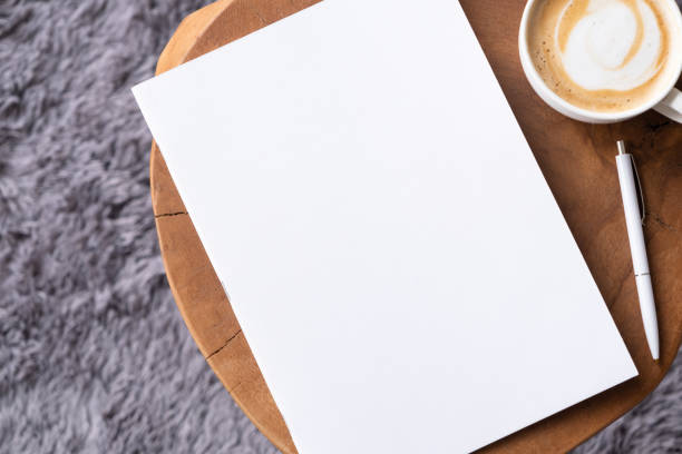 istock blank magazine mockup on coffee table with cappuccino, pen and grey rug 2120457381