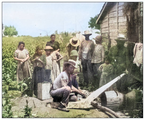 Antique black and white photograph of people from islands in the Caribbean and in the Pacific Ocean; Cuba, Hawaii, Philippines and others: Manufacturing a plough, Cuba