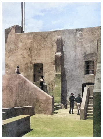 Antique black and white photograph of people from islands in the Caribbean and in the Pacific Ocean; Cuba, Hawaii, Philippines and others: Hobson Cell, Morro Castle, Santiago de Cuba