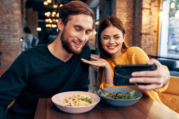 istock cheerful young couple restaurant leisure entertainment communication 2120560048