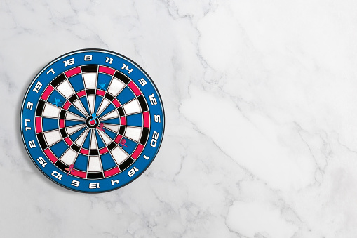 Target dart on a flat marble background