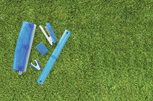 A group of office stationary supply on a grass