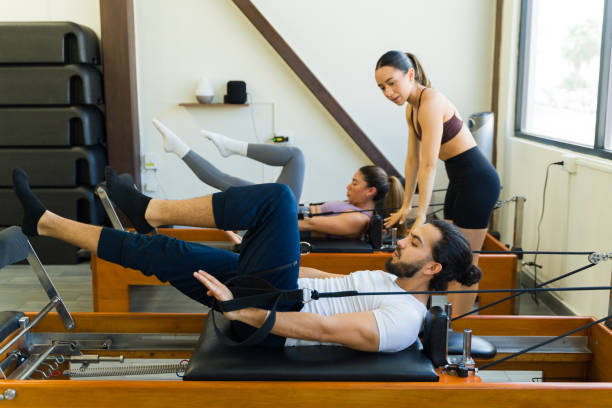 istock Pilates class with reformer machines in studio 2120571590