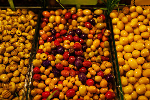 Istanbul, Turkey-February 17, 2024: Mixed varieties of olives in the market.
