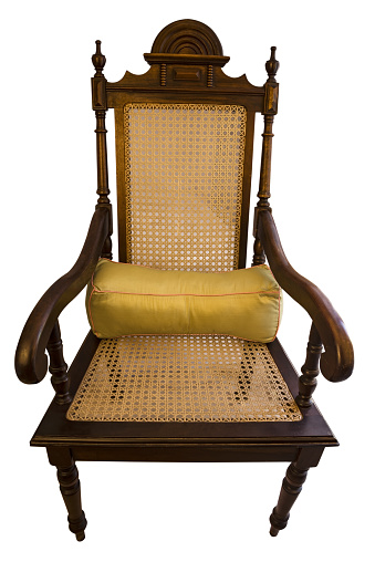 wooden chair in brown color with yellow cushion. Front view.