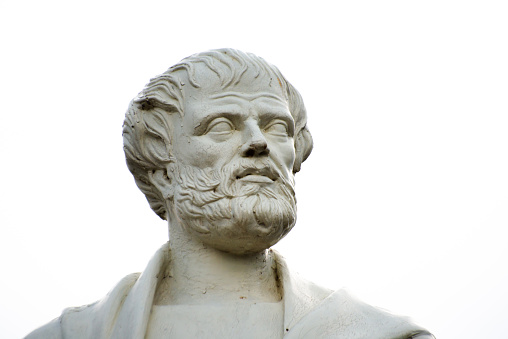 A captivating closeup of Aristotle's sculpted head, an ancient and artistic representation of the revered Greek philosopher in classic form.