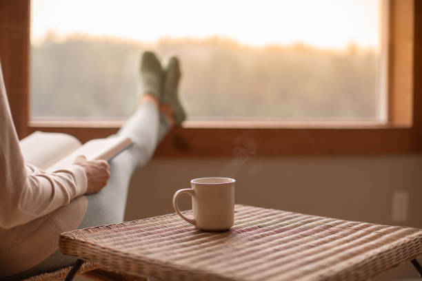 istock Cozy relaxing morning with book and warm drink 2120598747