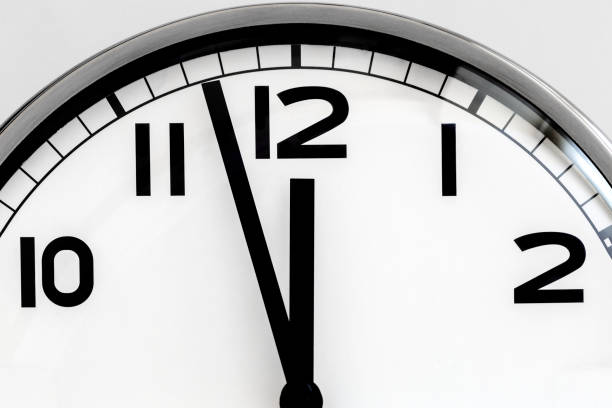 istock CLOCK-TWELVE CLOCK-12O'CLOCK-STOCK PHOTO 2120618207
