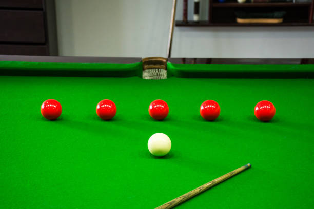 istock a green pool table with eight balls and a cue in the middle 2120655027