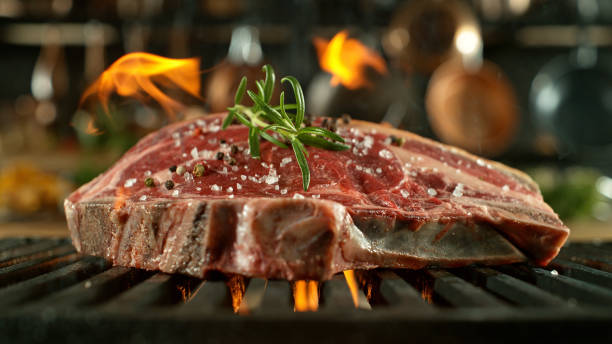 istock Close-up of tasty beef steak on cast-iron grate 2120657120