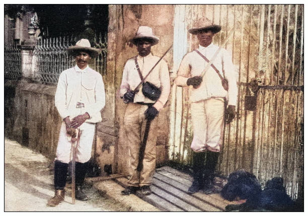 istock Antique black and white photograph: Cuban soldiers holding machetes 2120676741