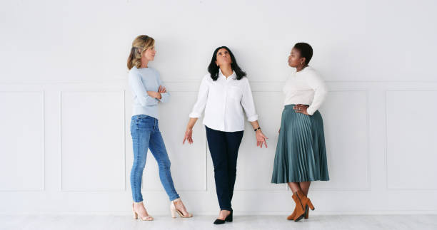 istock Business women, discussion and knowledge collaboration in studio and planning for corporate project. Designer, communication and creative idea for research on teamwork and support by white background 2120680365