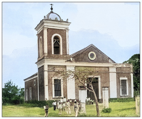 Antique black and white photograph of people from islands in the Caribbean and in the Pacific Ocean; Cuba, Hawaii, Philippines and others: Catholic Church, Nueva Gerona, Isla de la Juventud