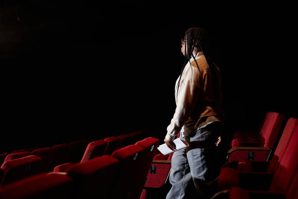 istock Woman Walking Down to Stage 2120720443