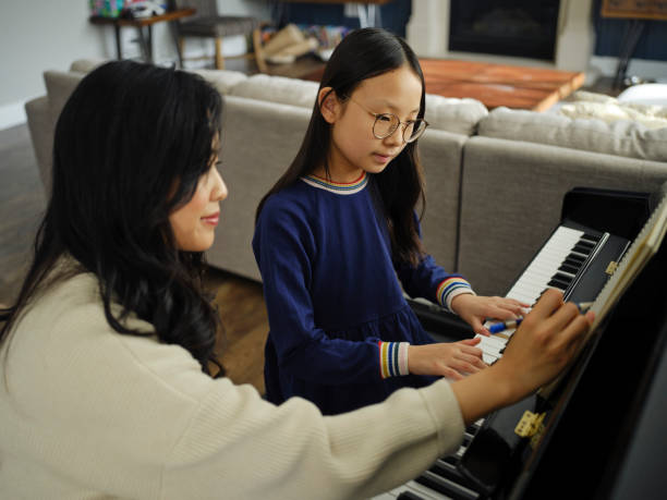 istock Piano Teacher and Student in a Home 2120721258