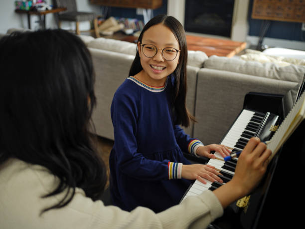 istock Piano Teacher and Student in a Home 2120721306