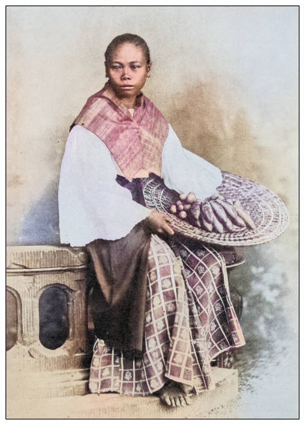 Antique black and white photograph of people from islands in the Caribbean and in the Pacific Ocean; Cuba, Hawaii, Philippines and others: Fruit vendor, Philippines