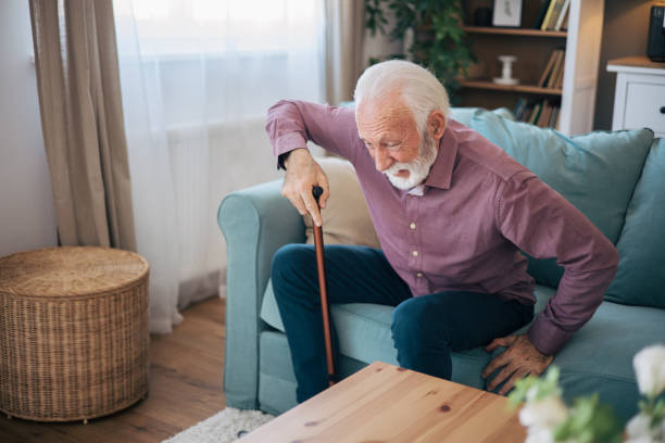 istock Senior man trying to stand up using walking cane 2120761003