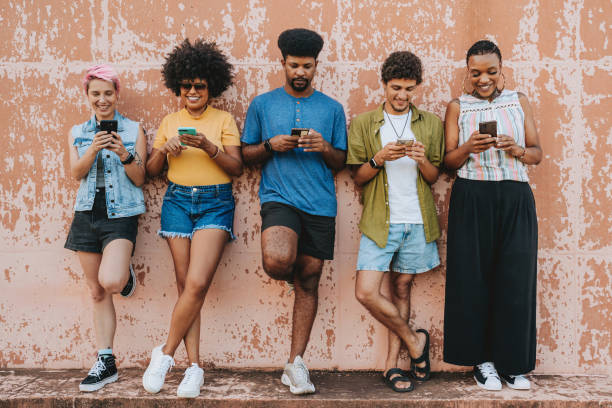 istock Group of friends using smartphone 2120762054