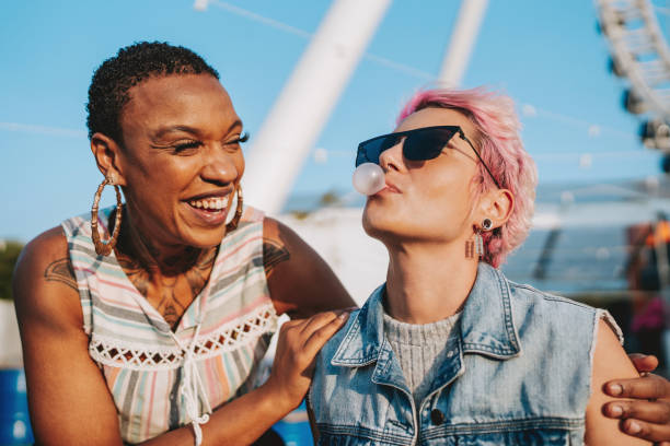 istock Two friends having fun bubble gum 2120762566