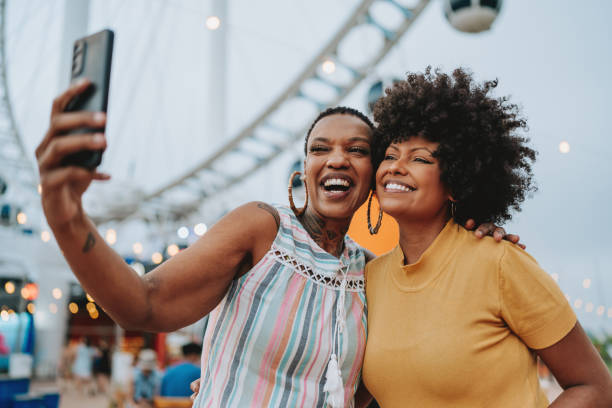 istock Two friends taking selfie with smartphone 2120764646