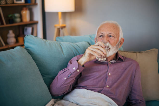 istock Senior man taking his pill 2120773999