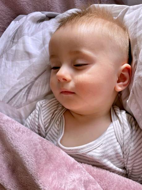 istock A little boy sleeps soundly during the day 2120786980