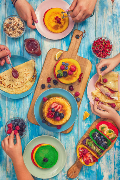 Glossy Pancakes with Colorful Chocolate Lentils as Topping