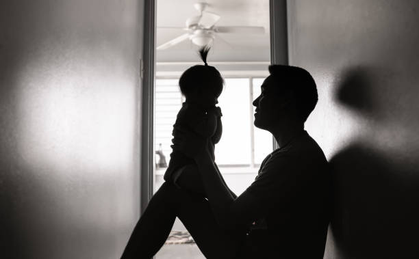 istock Father and baby at home playing. 2120843867