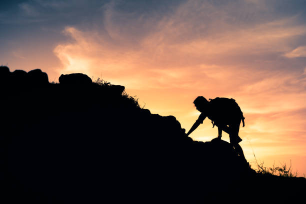 istock Men hiker climbing up the mountain. 2120849096